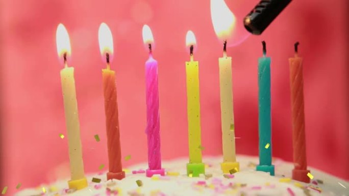金色五彩纸屑掉落在彩色生日蛋糕上的动画蛋糕蜡烛在蛋糕上点燃
