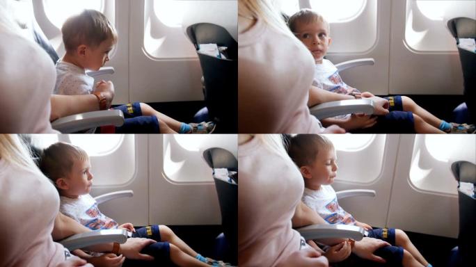 飞机起飞期间紧张和害怕的小男孩的4k镜头