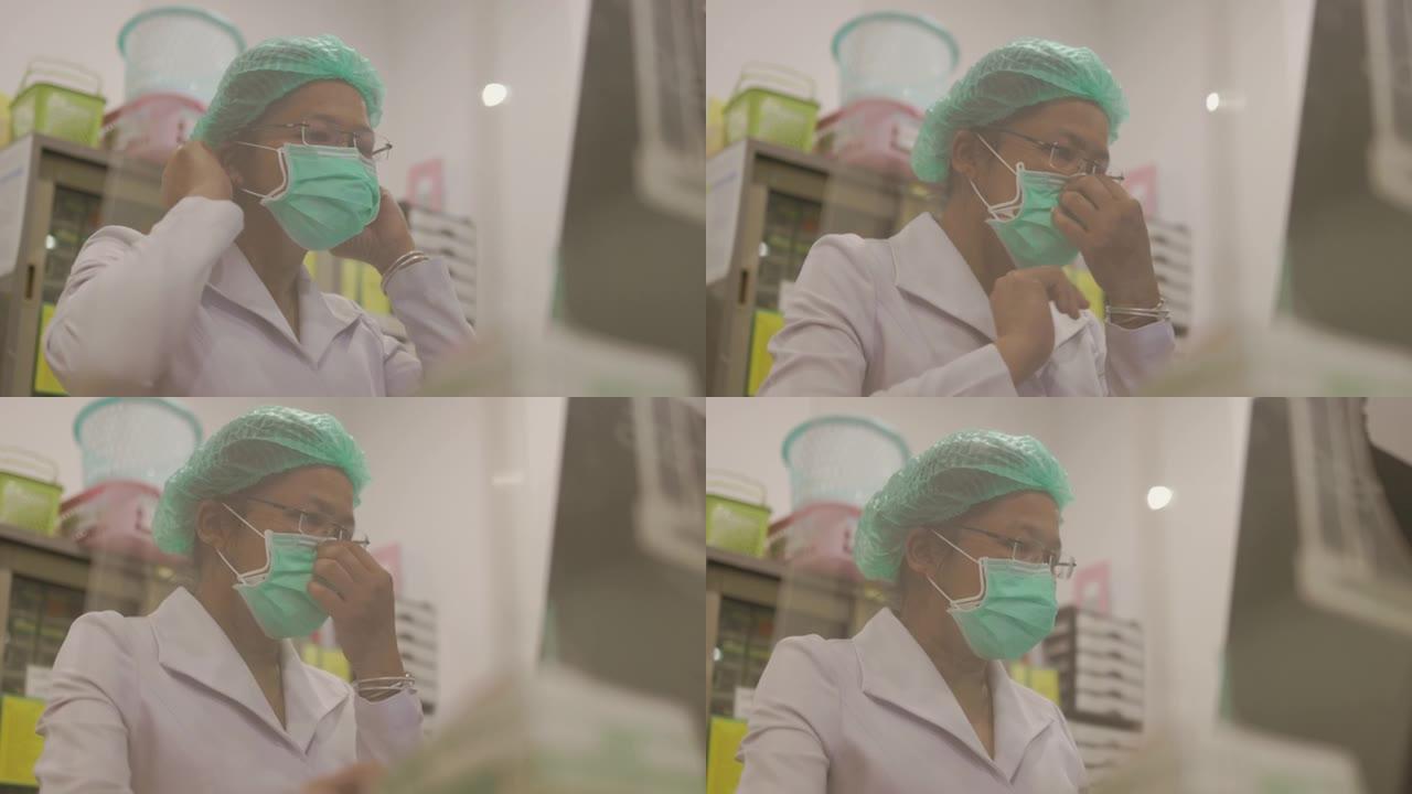 女高级护士工作前戴上外科口罩-库存视频