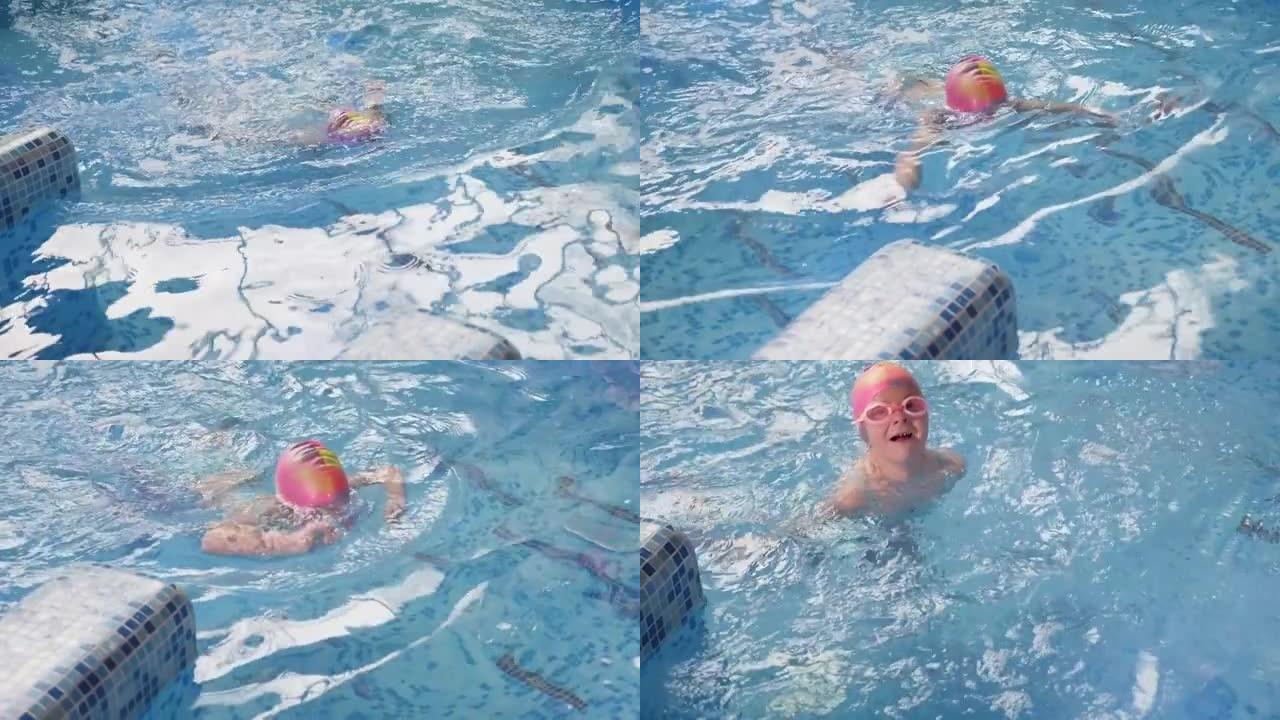 一个戴着游泳帽和眼镜的小女孩在游泳池水下游泳。