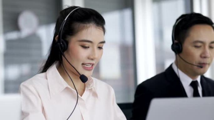 呼叫中心亚洲团队通过在线为客户佩戴耳机通话信息服务。集团服务运营商投资咨询商业金融对客户的服务意识。
