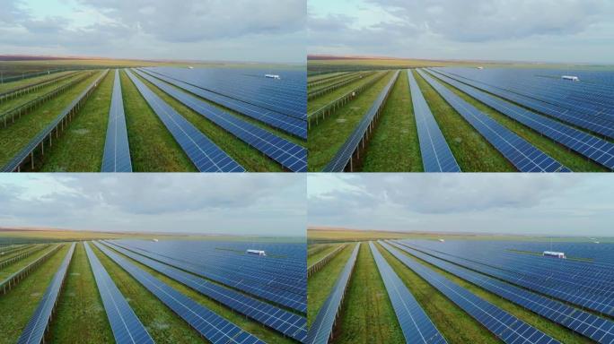 郊区太阳能发电厂的太阳能电池板。背景上的农田。多晶太阳能组件中的硅光伏电池。
