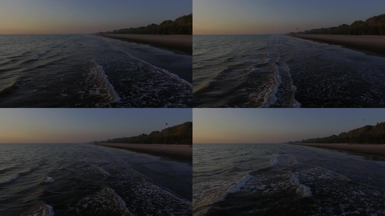 日落期间，科克斯巴扎尔海滩上的海鸥无人机视图向后移动