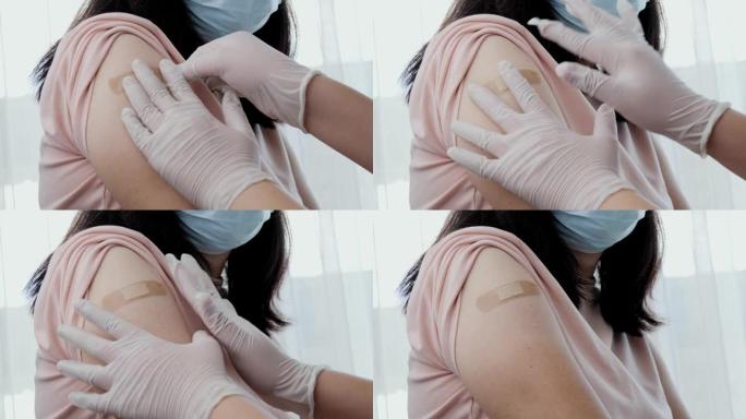 亚洲妇女戴口罩在医生办公室应用新型冠状病毒肺炎疫苗，健康的生活方式理念。