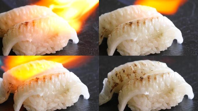 侥幸鳍尼吉里寿司的特写。用燃气燃烧器烘烤的视频。