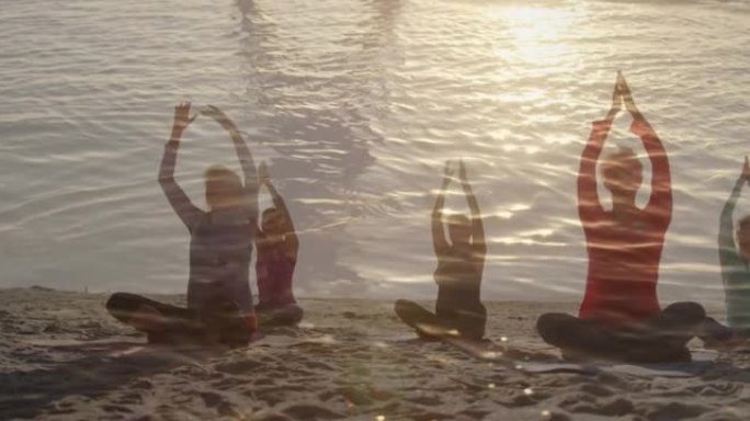 在海边练习瑜伽的高级女性身上发光的动画