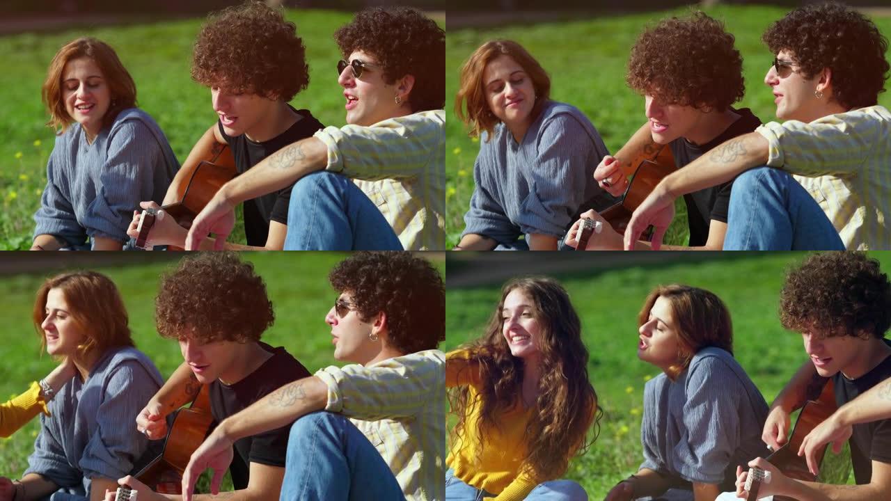 一起唱歌-坐在公园草坪上的年轻朋友一起唱歌