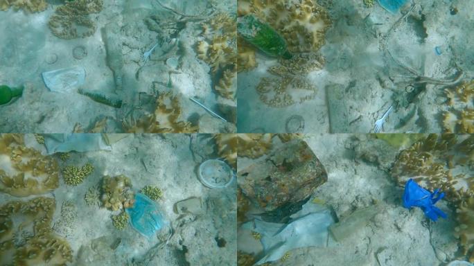 浅水热带珊瑚礁覆盖着塑料垃圾。海洋的塑料污染。塑料和其他杂物覆盖海底