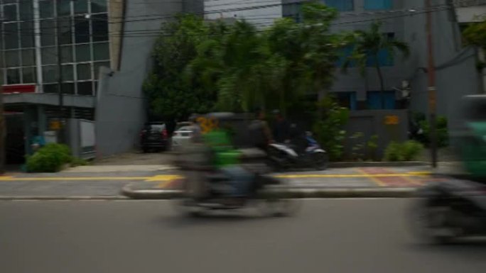 阳光灿烂的雅加达城市出租车乘客侧pov全景4ki印度尼西亚