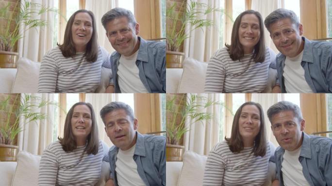 视频通话中，中年夫妇向摄像机打招呼的POV镜头