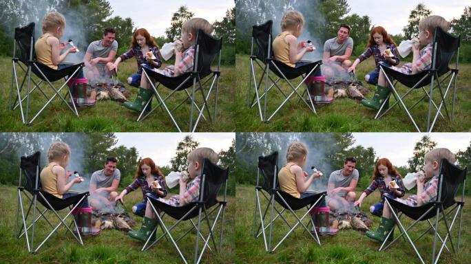 成年单身父亲与三个孩子一起享受野餐