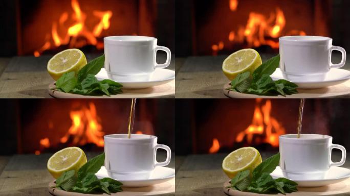 船上舒适的壁炉、茶壶和一杯柠檬和薄荷茶。