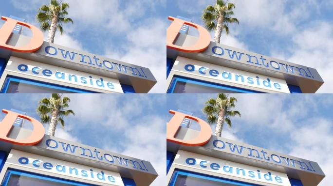 海滨名牌标志和棕榈树。Oside是美国最受欢迎的旅游胜地，美国加利福尼亚州圣地亚哥县太平洋西海岸。海