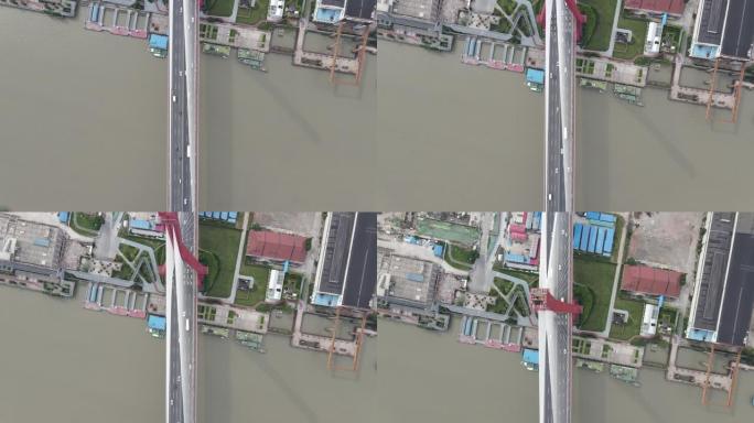无人机飞行沿着中国上海地标性杨浦大桥的桥梁移动