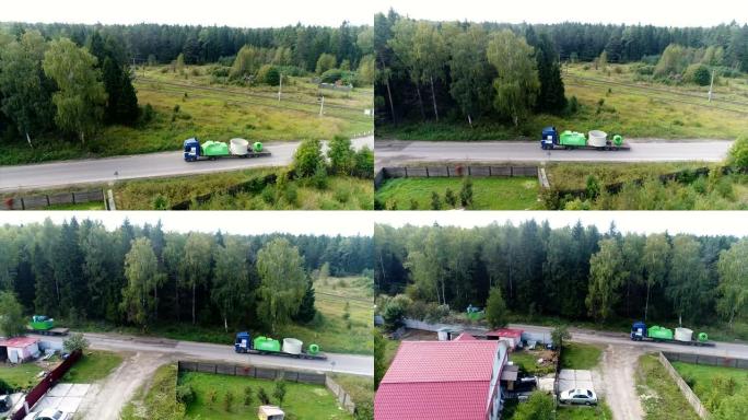 载有超大货物的卡车沿着村庄行驶。