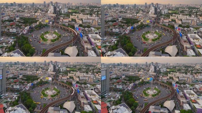 繁忙街道路上胜利纪念碑鸟瞰图的时间流逝。曼谷市中心天际线的环形交叉路口。泰国。智慧城市金融区中心。日