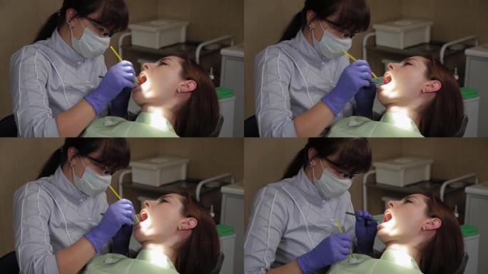 女牙医在医疗中心治疗牙齿