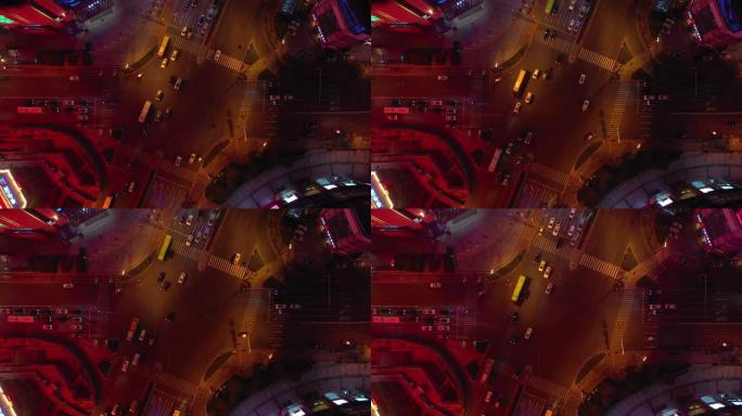 夜间照明青岛市市中心街道十字路口空中俯拍全景4k中国