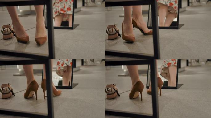年轻女性在镜子后面的服装店试鞋并旋转