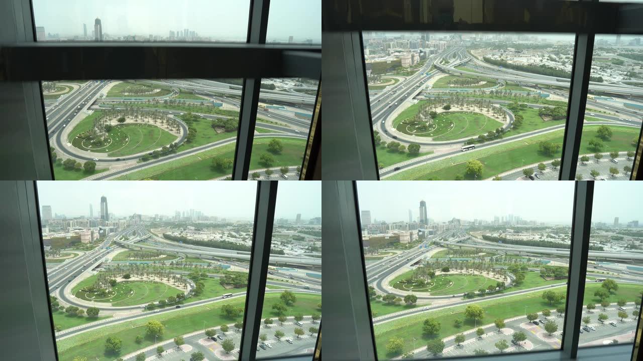 迪拜框架电梯视图下降看迪拜天际线和高速公路的风景。
