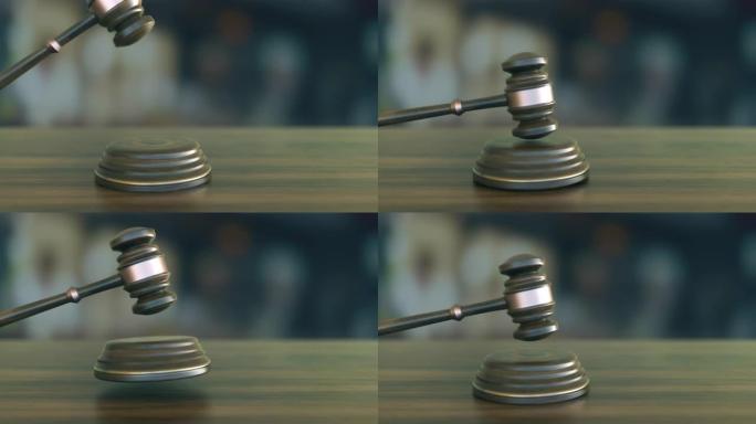 法官用木桌敲打着小木槌结束了听证会。慢镜头4 k。(Loopable)