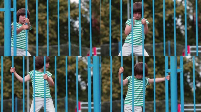 一个少年正在爬篱笆。培训协调运动