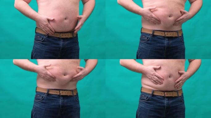 大肚子的胖子用手显示了一个标志。健康饮食和减肥的概念