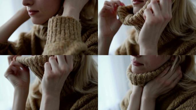 女人穿着保暖针织毛衣，享受柔软的面料，感觉舒适