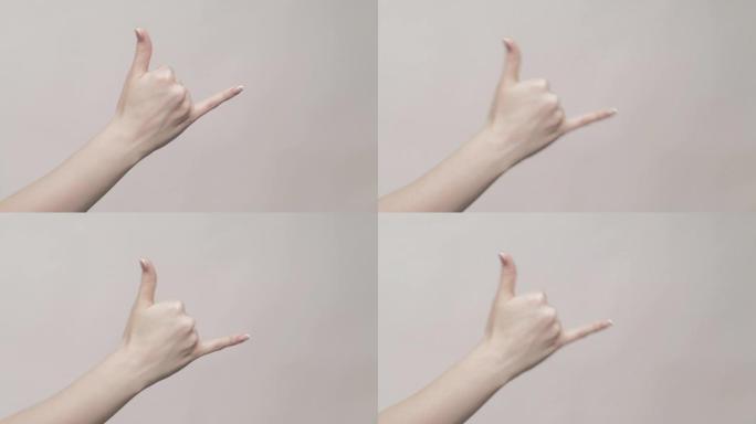 手势悬挂松散的女人显示沙卡标志