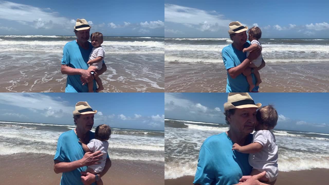 祖父在海滩上抱着婴儿