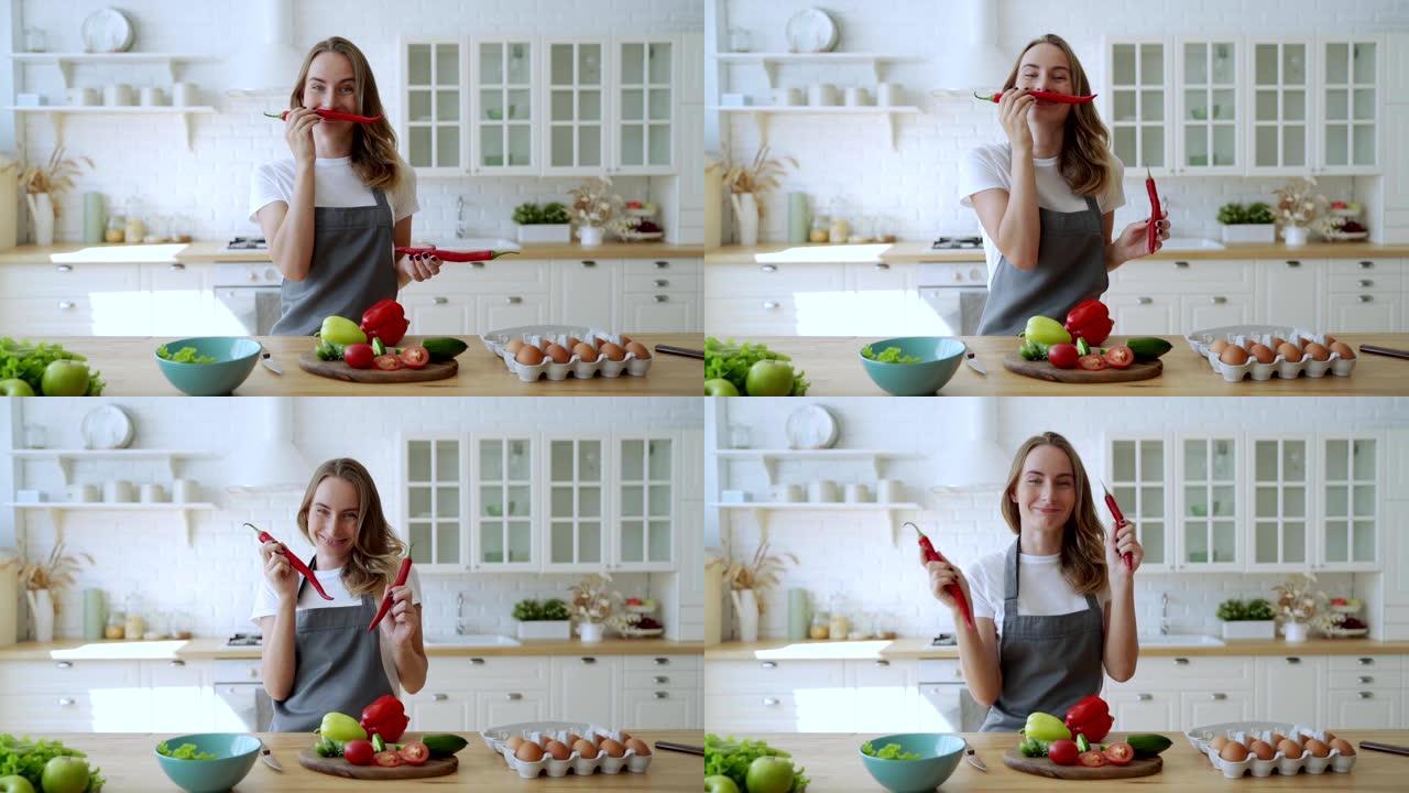 年轻女子在厨房里玩胡椒
