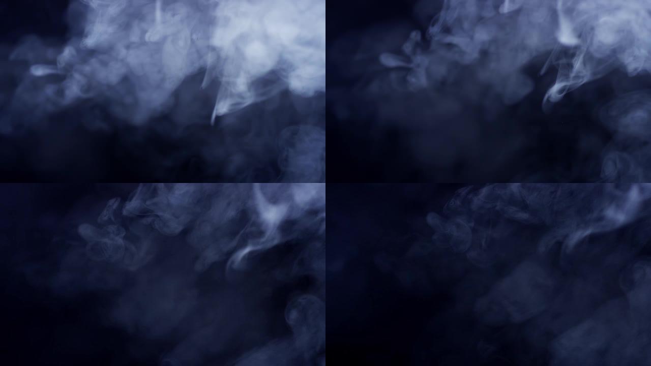黑色背景上的光照亮的灰色白色烟雾的慢动作拍摄