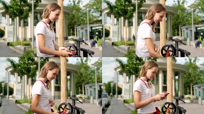 女人站在现代城市街道的停车场上，使用智能手机支付租赁电动踏板车的费用