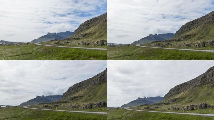 夏季，在冰岛蜿蜒的沿海道路上移动云层