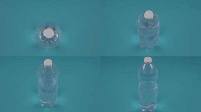 淡蓝色背景上带水的瓶子上方运动