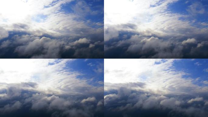 鸟瞰图在绿色森林上运行的云层在日出或日落时会随着白云的流逝而流逝。空中俯视云景。云的纹理。全景。快速