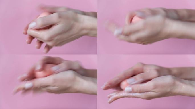 女性用粉红色肥皂洗手