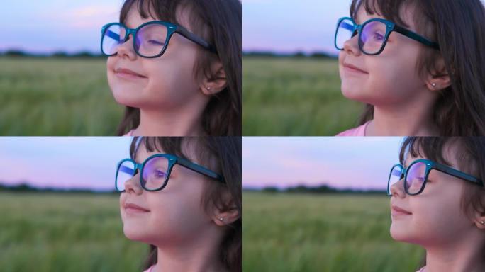一个戴眼镜的漂亮小女孩的肖像。