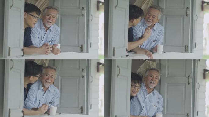 微笑亚洲父亲和大儿子呆在家里一段时间的检疫和社交距离