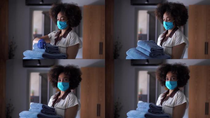 在新型冠状病毒肺炎期间，在酒店工作的4k视频女佣戴着防护口罩