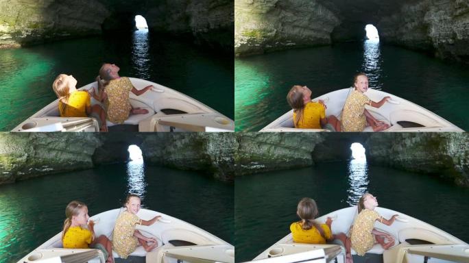 小女孩乘船探索洞穴