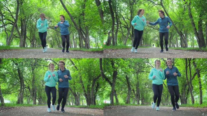 运动的年轻人跑步。夫妇白天在城市公园跑步