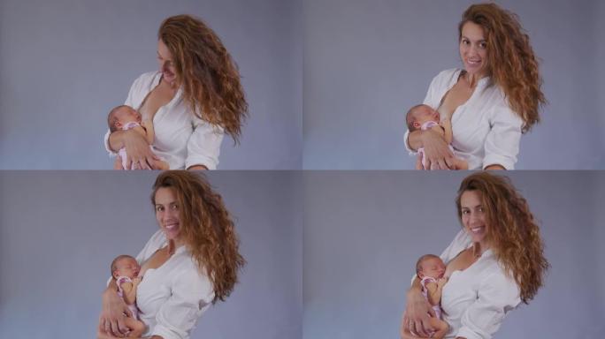 母亲和她刚出生的婴儿。快乐的母亲抱着她刚出生的女婴亲吻和拥抱。生育概念。为人父母。做母亲。美丽幸福的