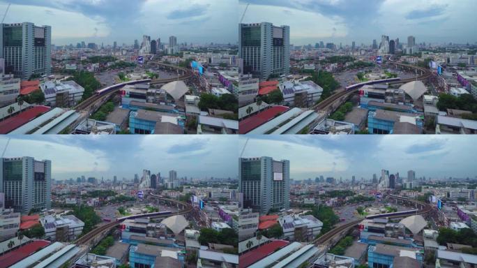 繁忙街道路上胜利纪念碑的鸟瞰图。曼谷市中心天际线的环形交叉路口。泰国。智慧城市金融区中心。摩天大楼。