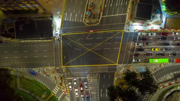 夜间照明新加坡市中心交通街十字路口空中延时全景4k