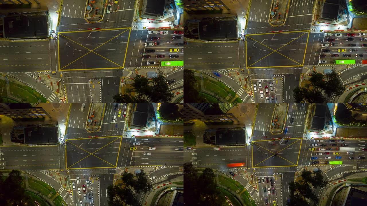 夜间照明新加坡市中心交通街十字路口空中延时全景4k