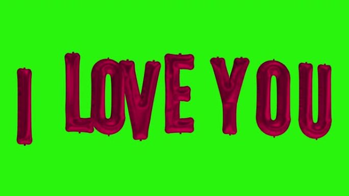 绿色屏幕上漂浮的氦气红箔气球字母我爱你的单词