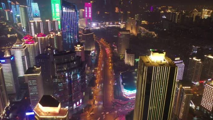 青岛市夜间照明市区繁忙交通街道十字路口空中全景4k中国