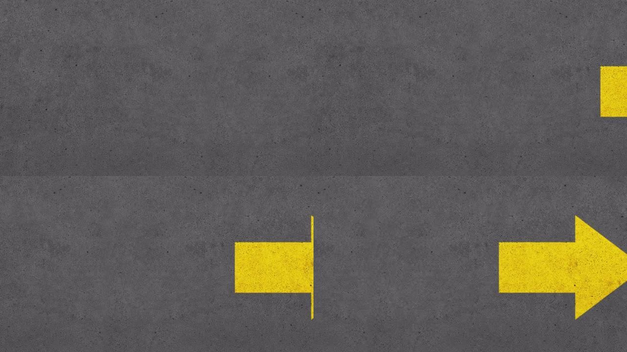 混凝土墙面平移上的黄色箭头标志