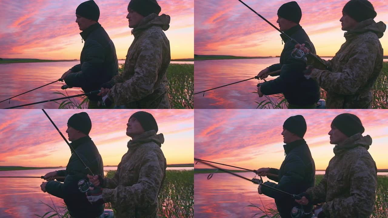 朋友钓鱼。两个人从船上钓鱼。业余垂钓者在平静的湖上从船上钓鱼